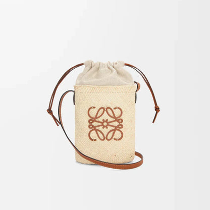 L°EWE - Square pocket in iraca palm and calfskin Beige